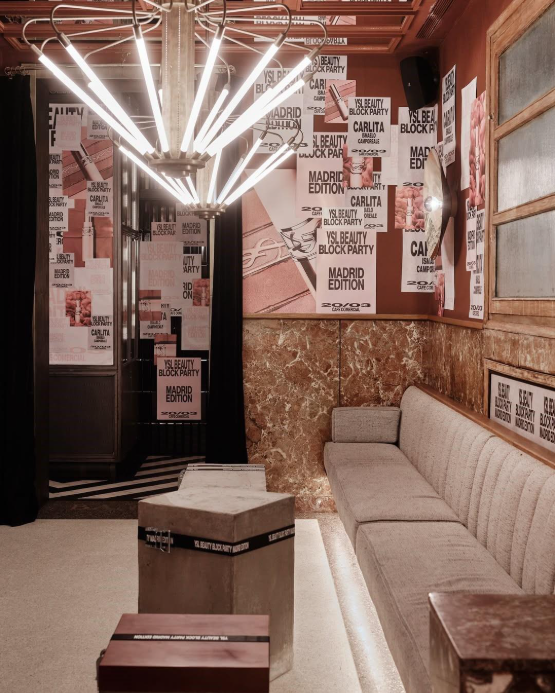 Interior of Café Comercial decorated with columns and YSL Beauty Block Party graphics.