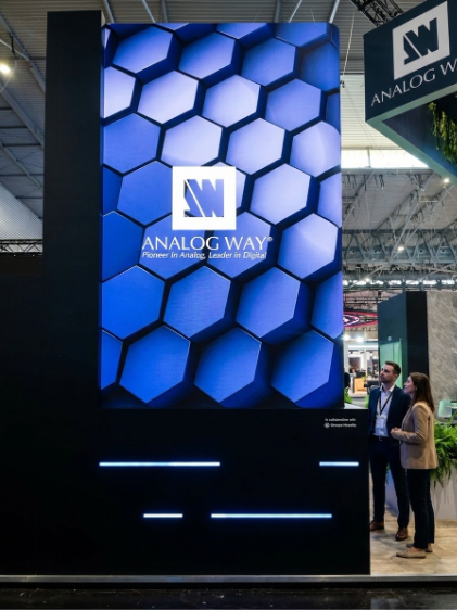 Large-format vertical LED screen at the Analog Way stand at ISE 2026.
